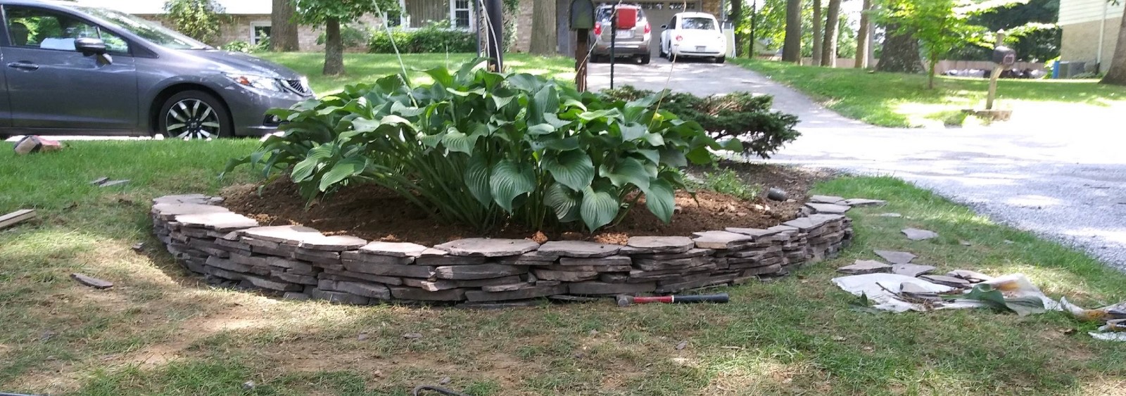 Bare garden area in York PA after decorative stone ring was installed